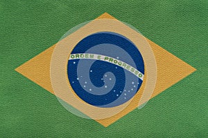 National emblem of Federative Republic of Brazil. Flag of Brazil on close up. Ordem e Progresso photo