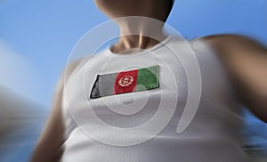 The national flag of Afghanistan on the athlete& x27;s chest photo