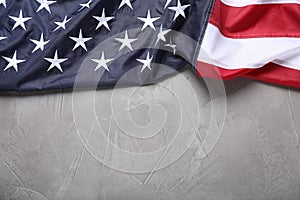National flag of America on light grey table, top view. Space for text