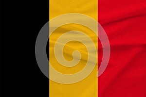 National flag of belgium on gentle silk with wind folds, travel concept, immigration, politics, copy space, close-up photo
