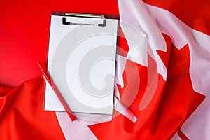 The National Flag of Canada. Canadian Flag or the Maple Leaf with empty paper note Copy space. Tourist traveler or