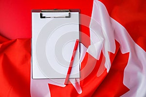 The National Flag of Canada. Canadian Flag or the Maple Leaf with empty paper note Copy space. Tourist traveler or