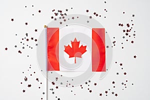 National Flag of Canada and confetti on white background. Happy Canada Day banner