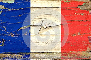 National flag of France painted on an old wooden surface