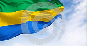 National flag of Gabon waving in the wind on a clear day