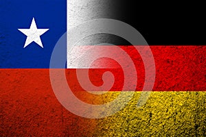 The national flag of Germany with The Republic of Chile National flag. Grunge background