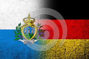 The national flag of Germany with The Republic of San Marino National flag. Grunge background