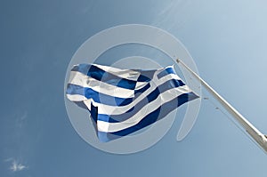 National flag of Greece waving on flagpole sky background