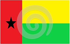 The national flag of Guinea-Bissau with Pan African colors of red green and gold yellow
