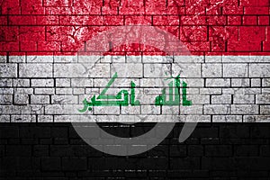 National flag of Irak on brick  wall background. photo
