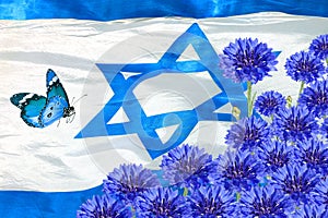 National flag of Israel and spring blue flowers. Independence Day of Israel state