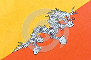 National flag of the Kingdom of Bhutan on a fabric basis