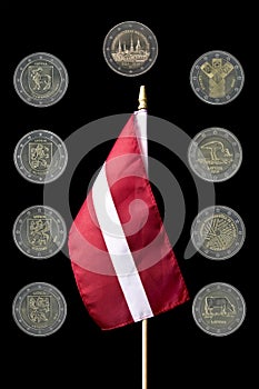 National flag of Latvia and commemorative 2 euro coins