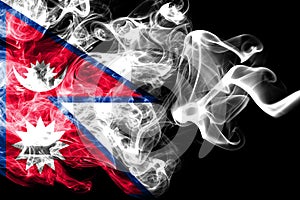 National flag of Nepal made from colored smoke isolated on black background. Abstract silky wave background