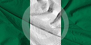 national flag of nigeria on silk fabric with soft folds, background