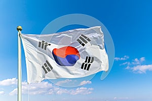 National flag of republic of Korea waving against with blue sky background