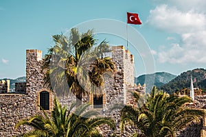 National flag of Turkey on the castle wall in Marmaris.