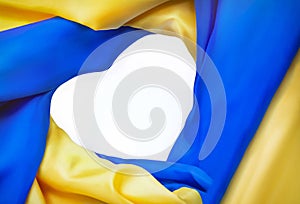 National flag of Ukraine in form of heart. Fabric curved flag  in yellow-blue colours in heart-shaped on white background.