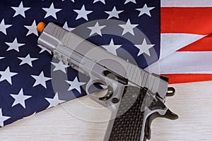 National flag United States with hand gun