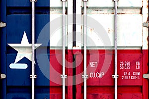 The national flag of the US state Texas in a container doors on the day of independence in different colors of blue red and yellow