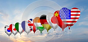 National Flags against blue sky with sun and cloud