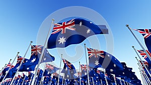 The National flags of Australia against blue sky.