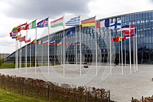 The national flags of countries member of the NATO fly outside the organisation headquarters in Brussels, Belgium on April 20 2023