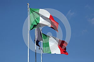 National flags of Italy and a flag of European Union.