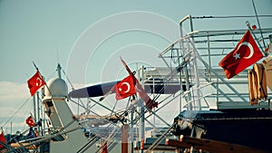 National flags of Turkey on docked Turkish ships and boats