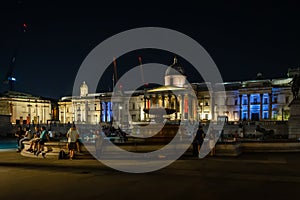 The National Gallery, Trafalgar Square at night in London, England, UK