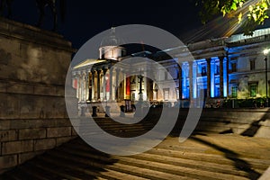 The National Gallery, Trafalgar Square at night in London, England, UK