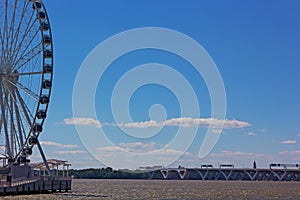 National Harbor Ferris wheel and Woodrow Wilson Memorial Bridge.