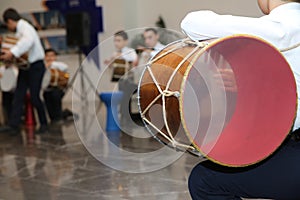 The national instrument of Azerbaijan nagara . children in national costumes play drums . Young azeri guys playing