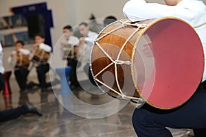 The national instrument of Azerbaijan nagara . children in national costumes play drums . Young azeri guys playing