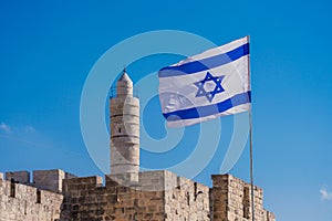 National Israeli Flag waves in Jerusalem photo