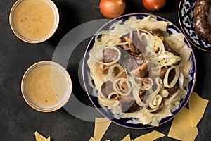 National Kazakh dish - Beshbarmak and meat bouillon