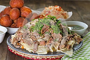 National Kazakh dishes: Beshbarmak, salad of radish Shalgam, and Baursak.