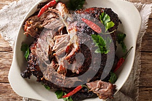 National Latin American dish of Pernil Asado shredded pork closeup on a plate. horizontal top view photo