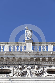 National Library of St Mark`s Biblioteca Marciana, statue at the top, Venice, Italy photo