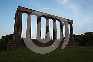 National Monument of Scotland in silhouette on Calton Hill, Edinburgh, Scotland