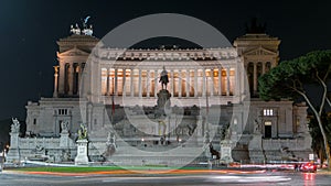 National monument of Victor Emmanuel II at night and road traffic timelapse, Rome