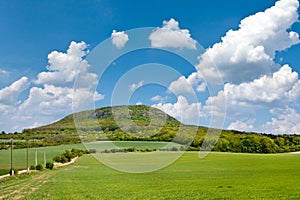 National mystic hill Rip, Central Bohemia, Czech republic - spring landscape with green fields and blue sky with clouds