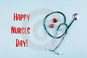 National Nurse Day Holiday Background. Medical stethoscope, two red hearts and wooden letters text
