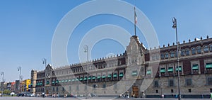 National Palace in Zocalo square Mexico city. Architecture, travel photo. View with blue sky. Background