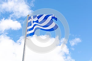 National symbol of Greece, blue-white greek flag, sea water and blue sky, copy space