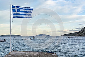 National symbol of Greece, blue-white greek flag, sea water and blue sky, copy space