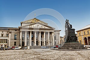 The National Theater and the statue of Maximilian I Joseph on a throne in the square of Max Joseph Square. Munich, Bavaria