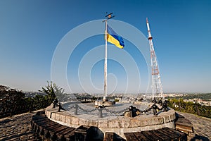 National Yellow-blue Ukrainian flag against the blue sky on mound of Union of Lublin at Castle Hill in Lviv city, Ukraine