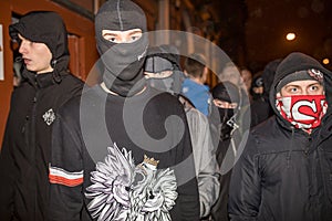 Nationalists, hooligans and fascists awaiting the Parliament Member Winnicki. On the other side of street people protesting agains