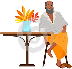 Nationality Indian elderly man sitting on chair at table male character traditional outfit isolated